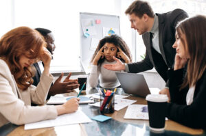 Stressed employees argue at office.