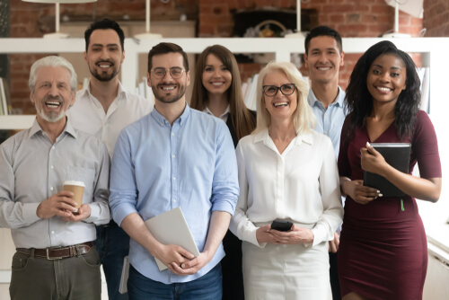 group of people smiling in office